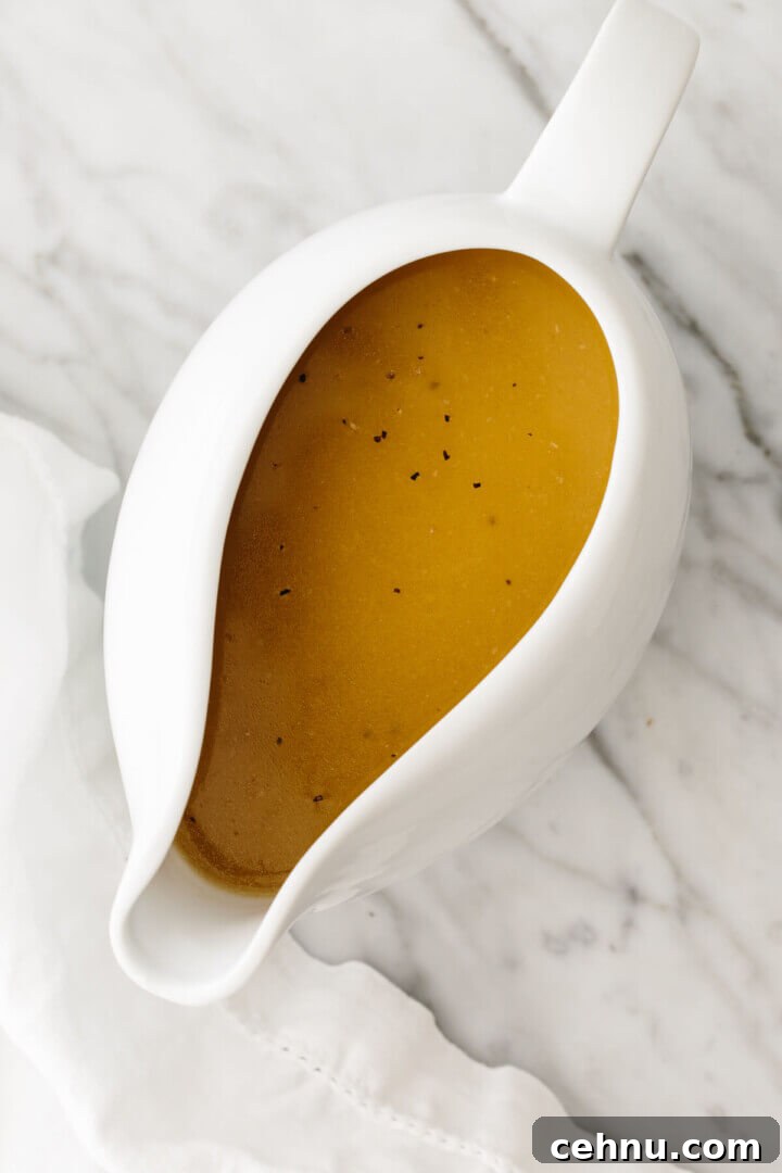 Thanksgiving Menu Ideas and Classic Holiday Recipes 15 Turkey gravy in a boat next to a napkin