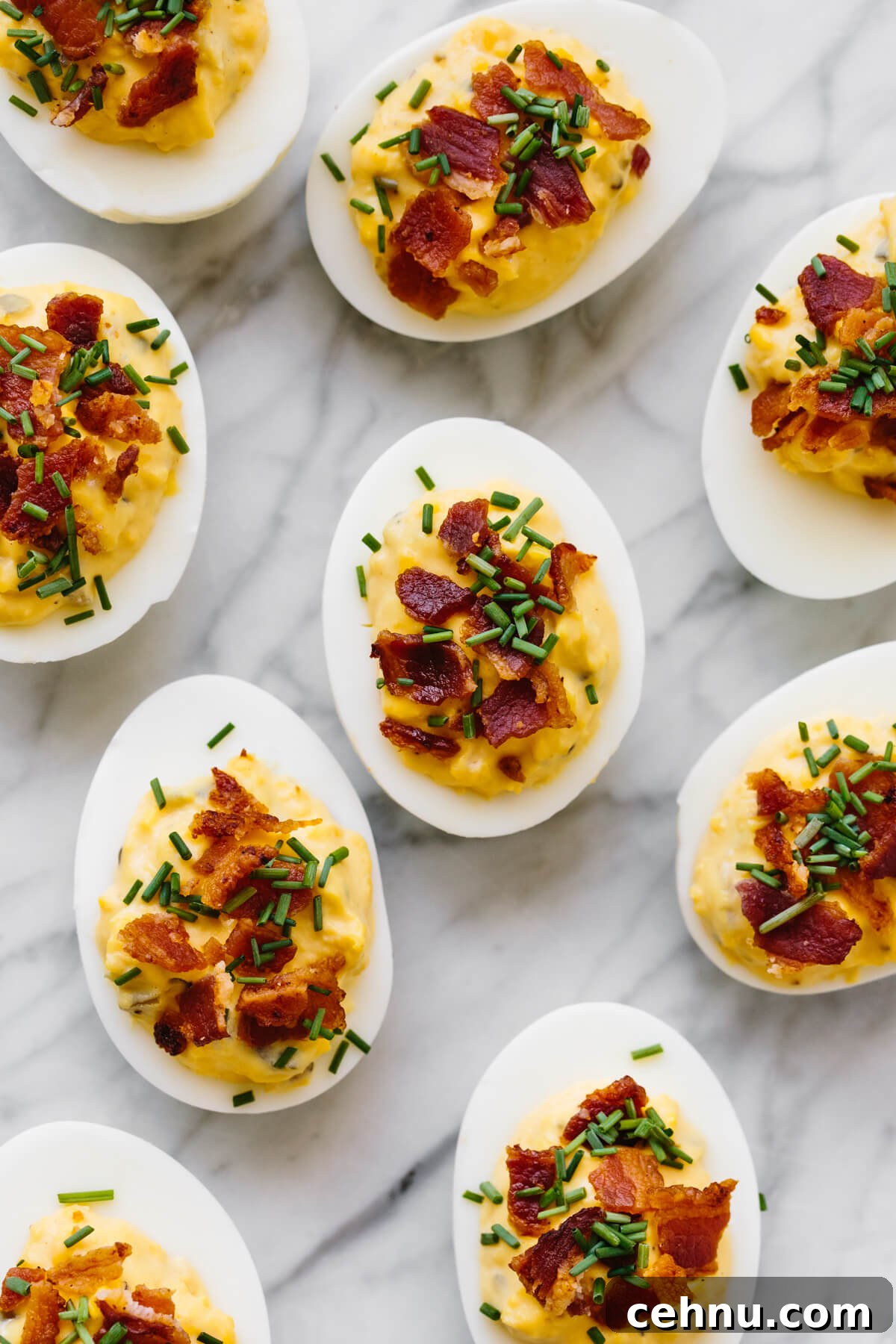 Thanksgiving Menu Ideas and Classic Holiday Recipes 3 Several bacon deviled eggs on a marble counter.