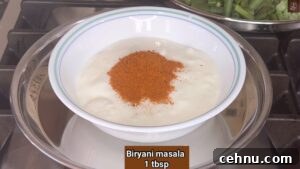 Pressure Cooker Vegetable Biryani Recipe 11 Add biryani masala to curd