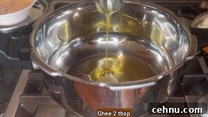 Pressure Cooker Vegetable Biryani Recipe 18 Add ghee to pressure cooker