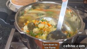 Pressure Cooker Vegetable Biryani Recipe 34 Reduce flame before adding curd