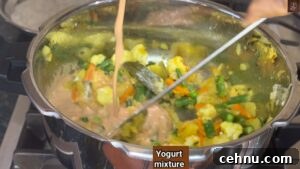 Pressure Cooker Vegetable Biryani Recipe 35 Add yogurt masala to cooker