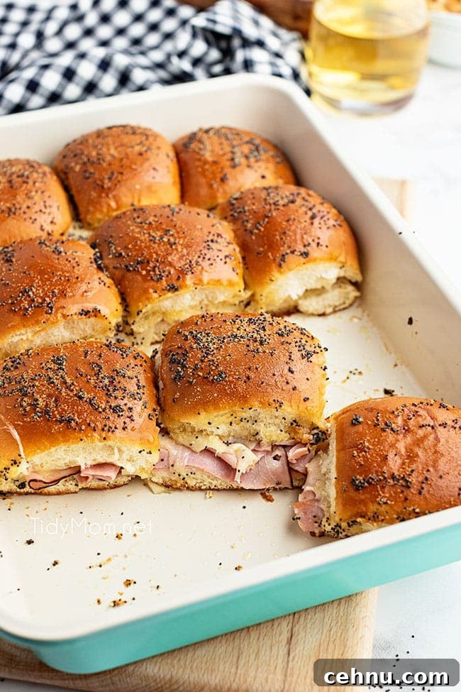 Ham and Swiss Sliders Recipe with Honey Mustard Glaze 6 ham sliders in blue baking dish