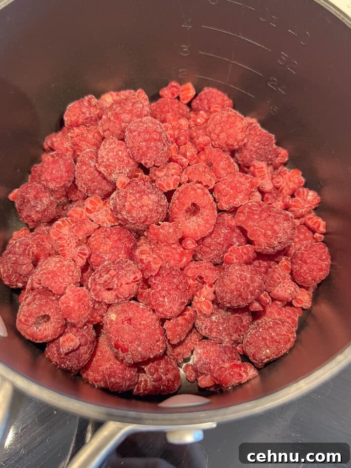 Frozen raspberries in a saucepan