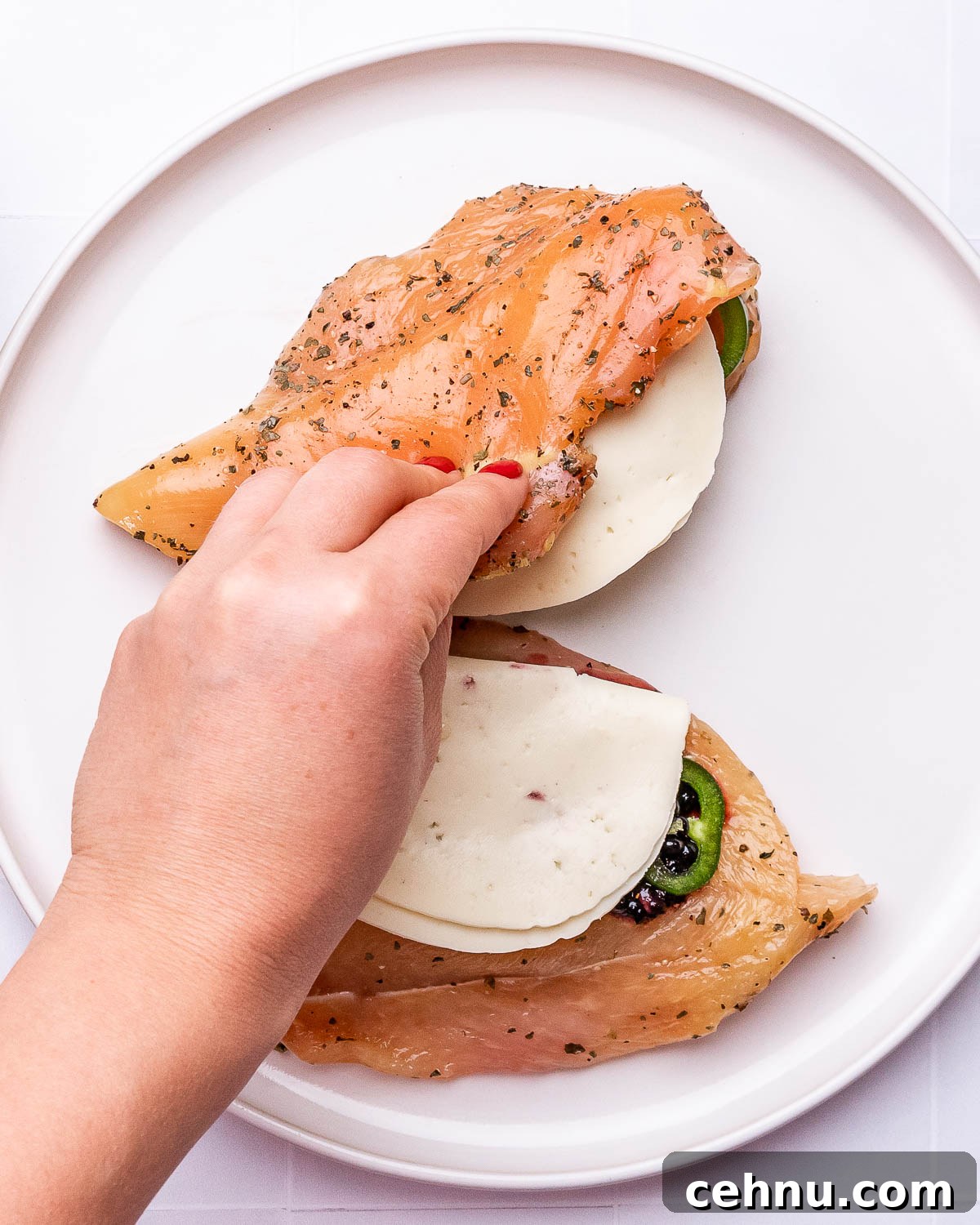 Searing stuffed chicken in skillet
