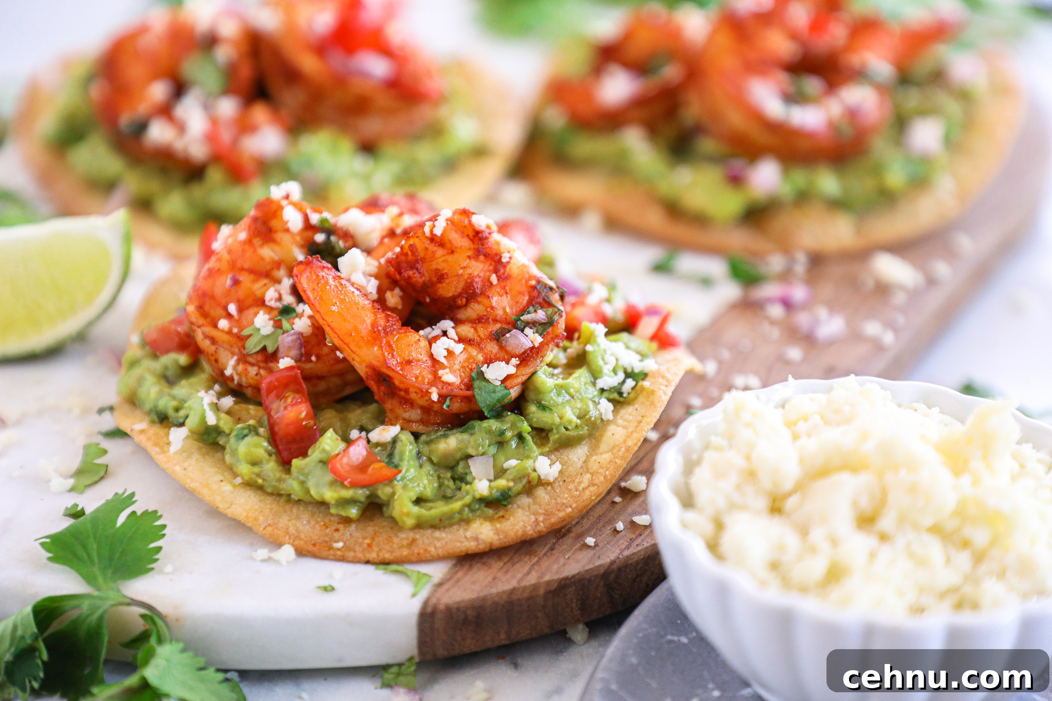 Spicy shrimp tostadas are such an easy meal for during the week! They take no time at all to make and are packed full with flavor!