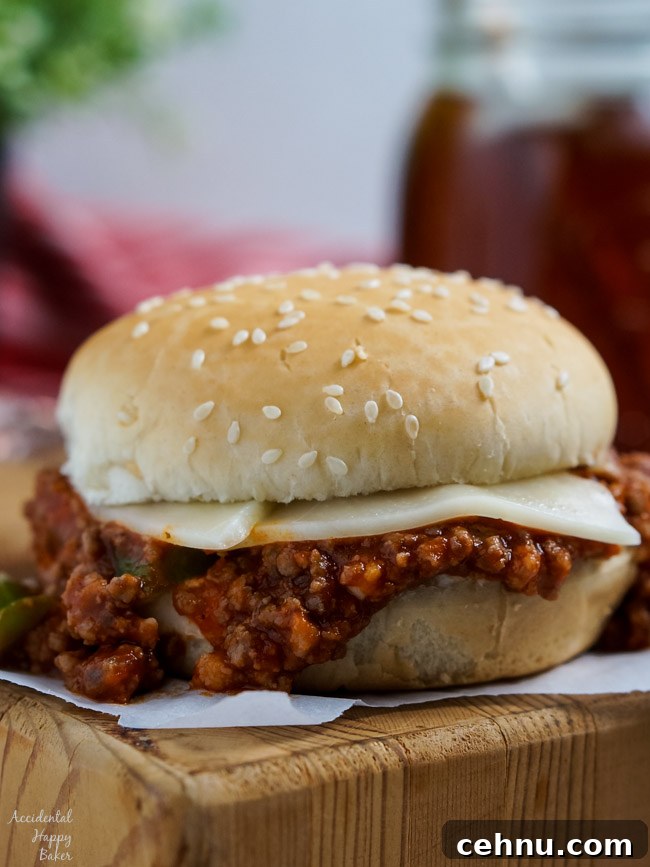 An Italian Sloppy Joe Sandwich sitting on a cutting board.