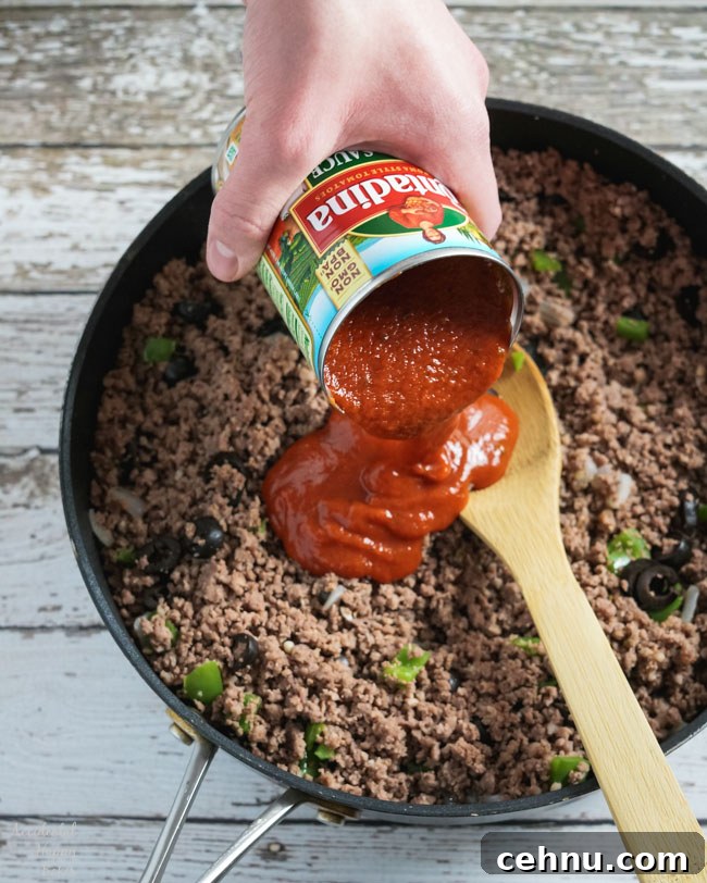Pizza Sauce is added to the ground beef mixture.