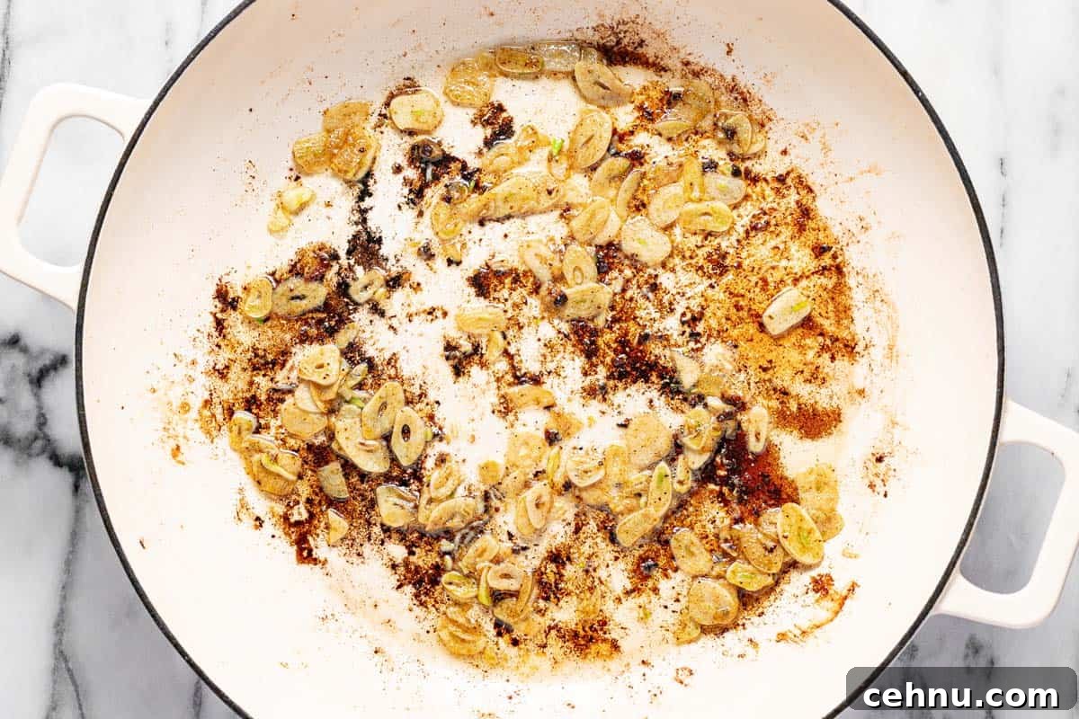20-Minute Honey Garlic Chicken 5 Sliced garlic sauteed in pan drippings in a large saute pan.