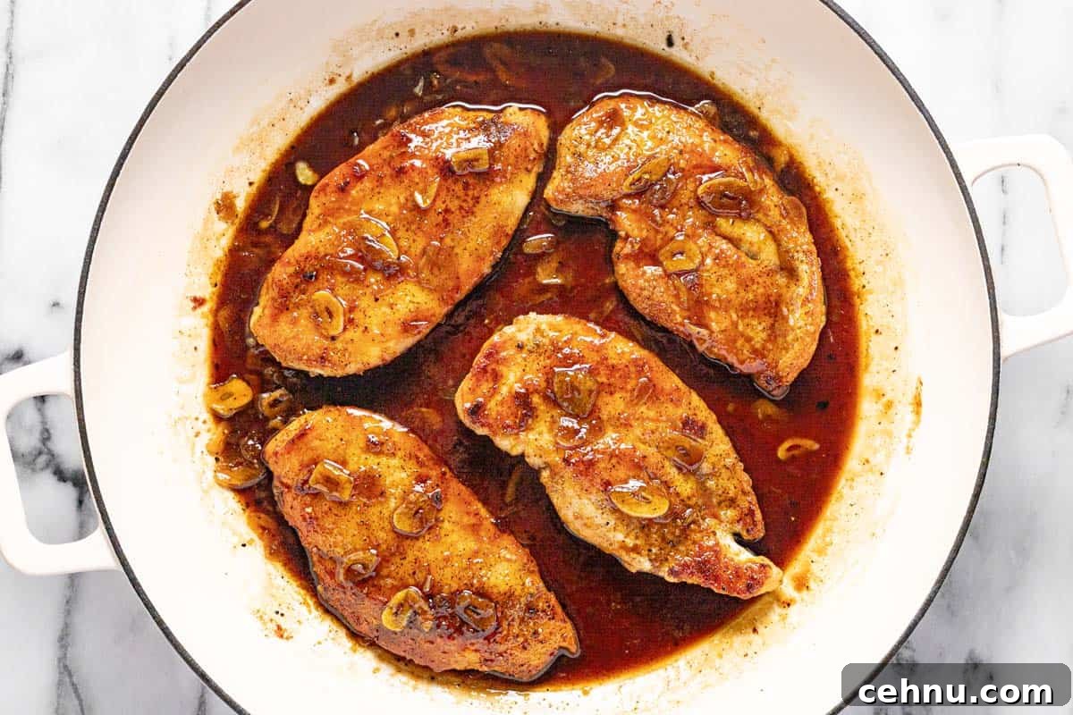 20-Minute Honey Garlic Chicken 6 Large pan filled with sauteed chicken breast in a honey garlic sauce.