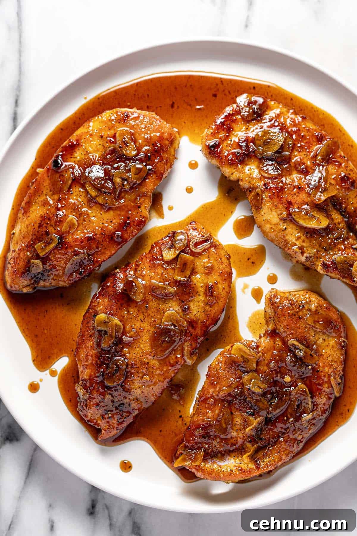 20-Minute Honey Garlic Chicken 7 Large round plate with honey garlic chicken breast.