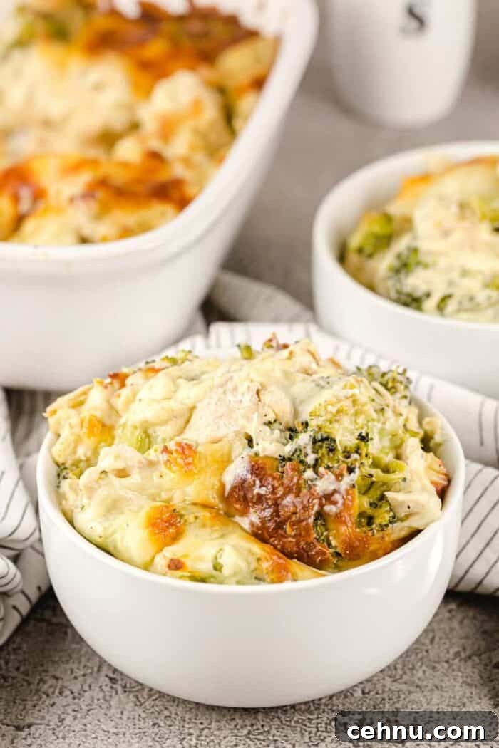 closeup of small white bowl containing a serving of keto chicken broccoli casserole