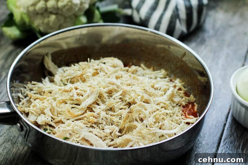 Shredded chicken in a pan.