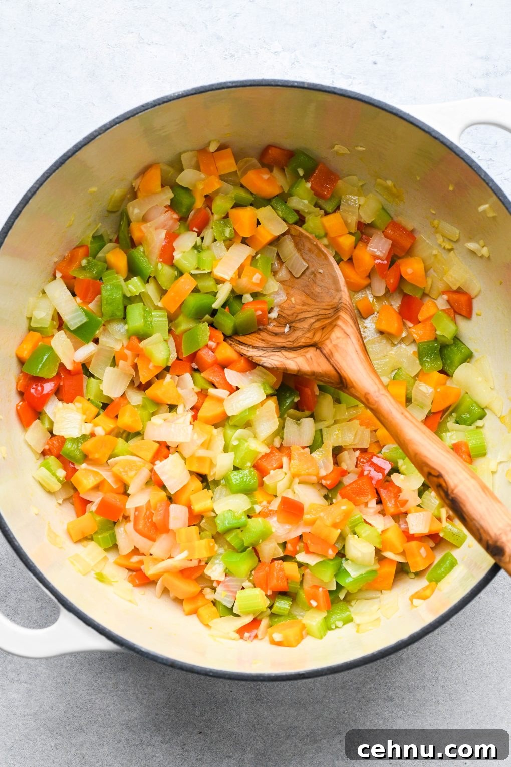 Veggies sauteed in a large soup pot.