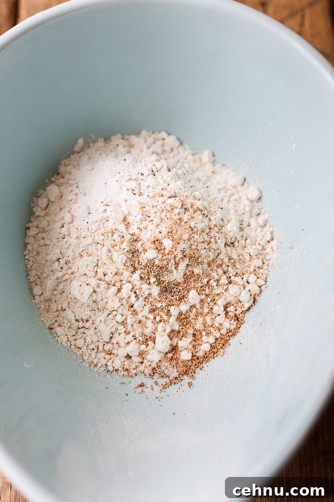 Dry ingredients for strawberry rhubarb cake in a mixing bowl.