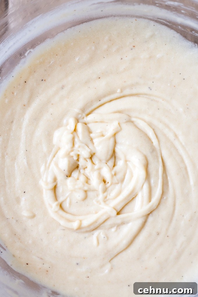 Strawberry rhubarb cake batter in a bowl.