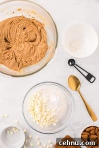 Whisking together flour, white chocolate chips, and baking powder.
