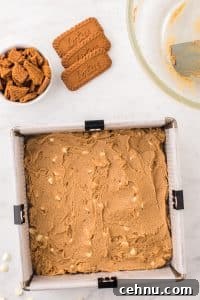 An 8X8 baking pan filled with blondie batter.