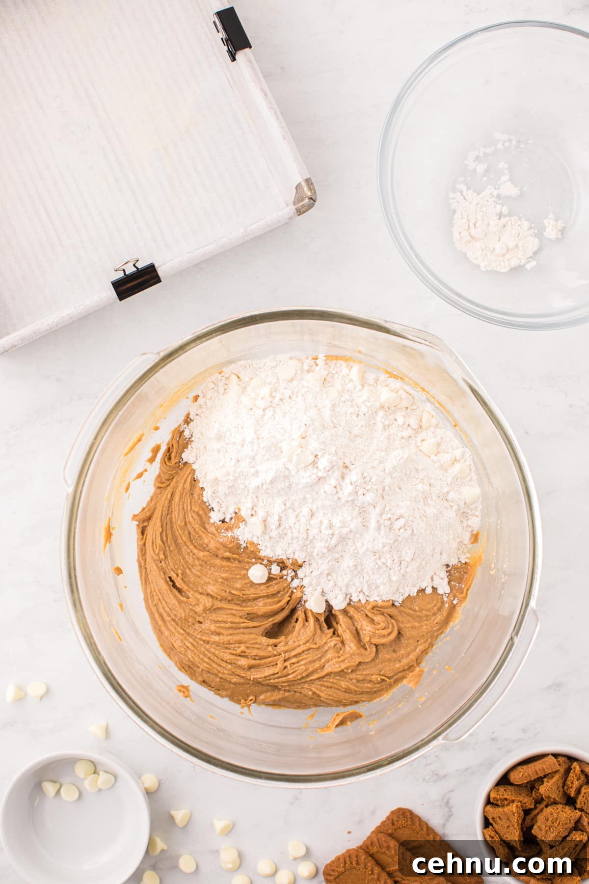 Adding flour to blondie batter.