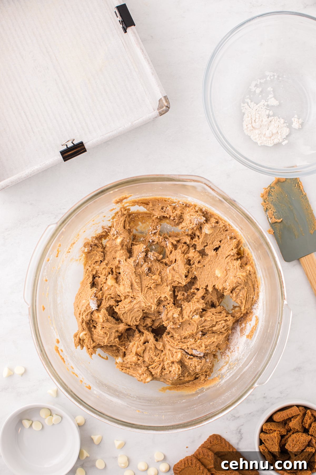 A bowl of blondie batter with white chocolate chips.
