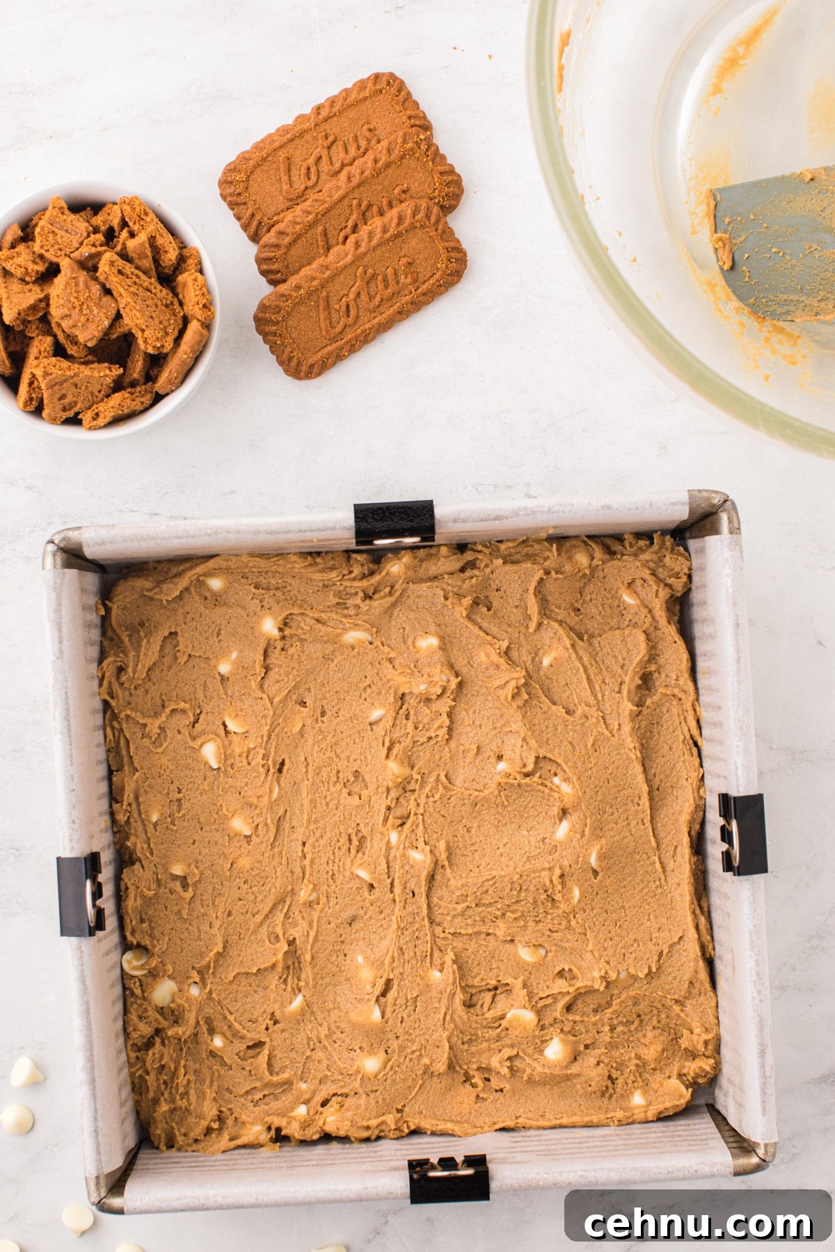 An 8X8 baking pan filled with blondie batter.