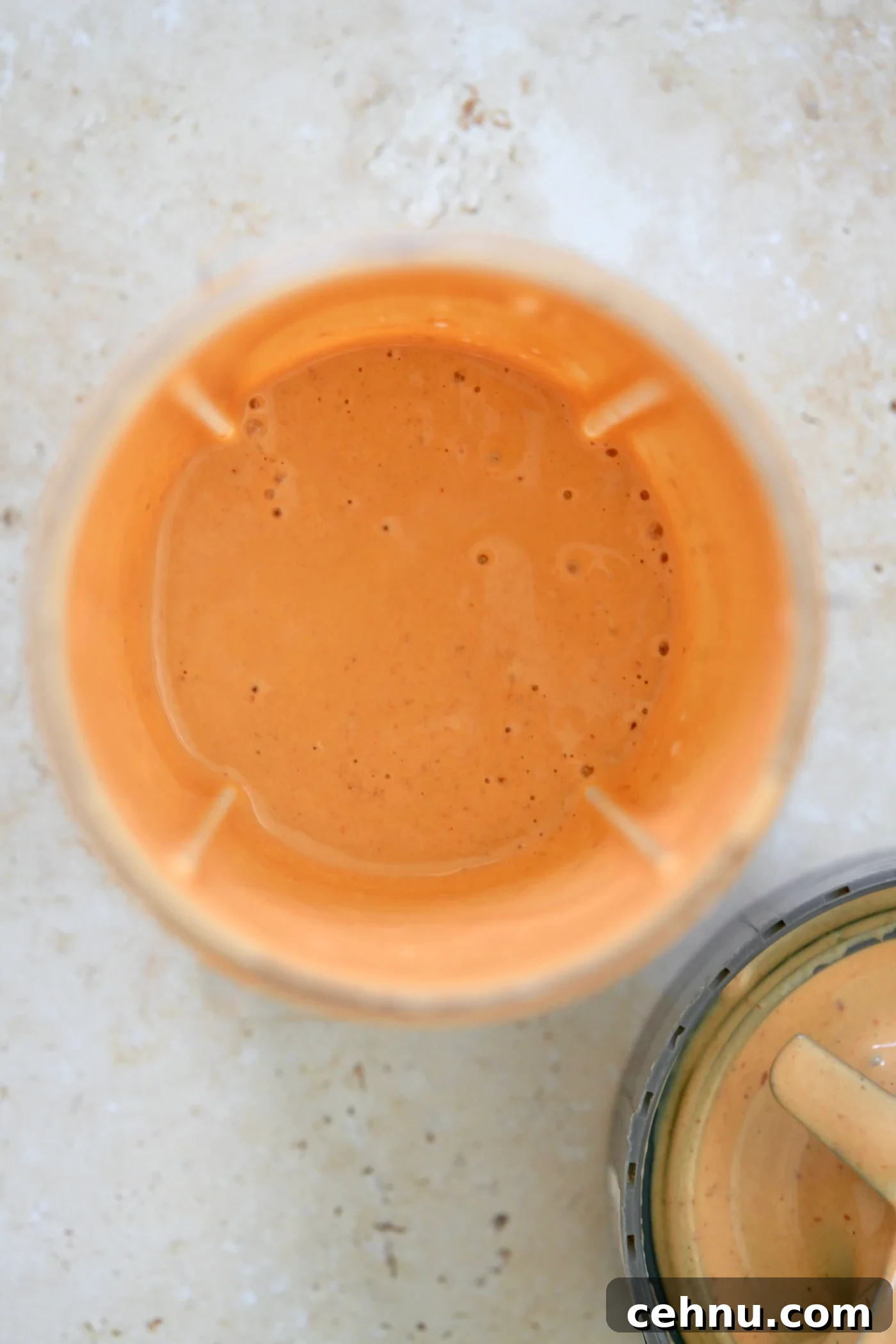 blended orange sauce in blender jar