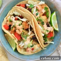 blue bowl with veggie stuffed tacos in it.