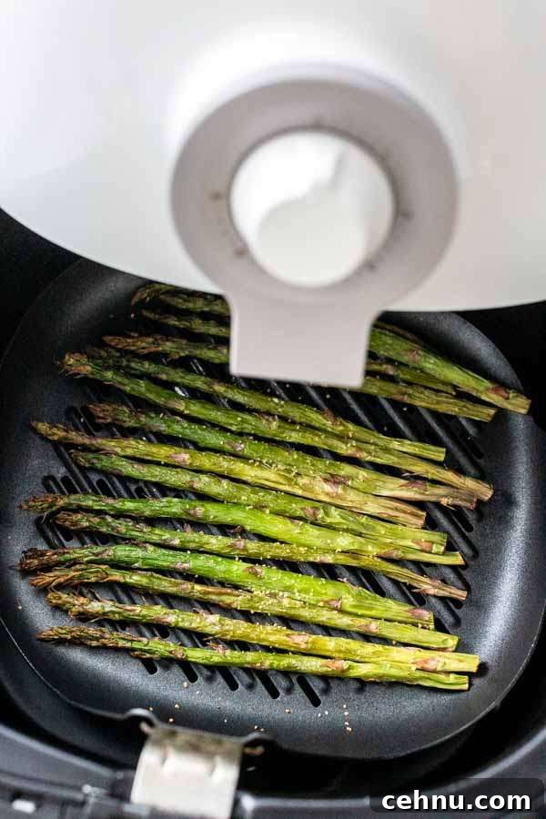 Asparagus in the Air Fryer with dark grill marks, ready to serve as a fast vegetable side dish