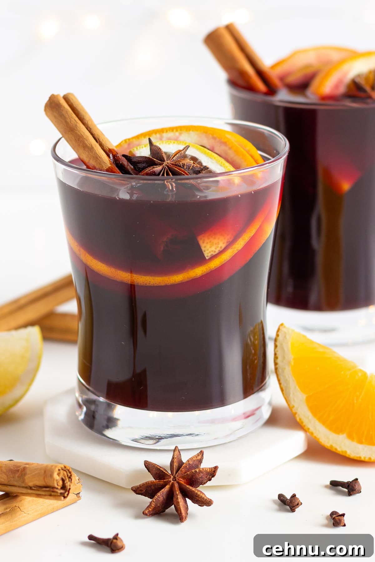 Glühwein: Traditional German Mulled Wine Recipe 11 Two garnished glasses of Gluhwein.