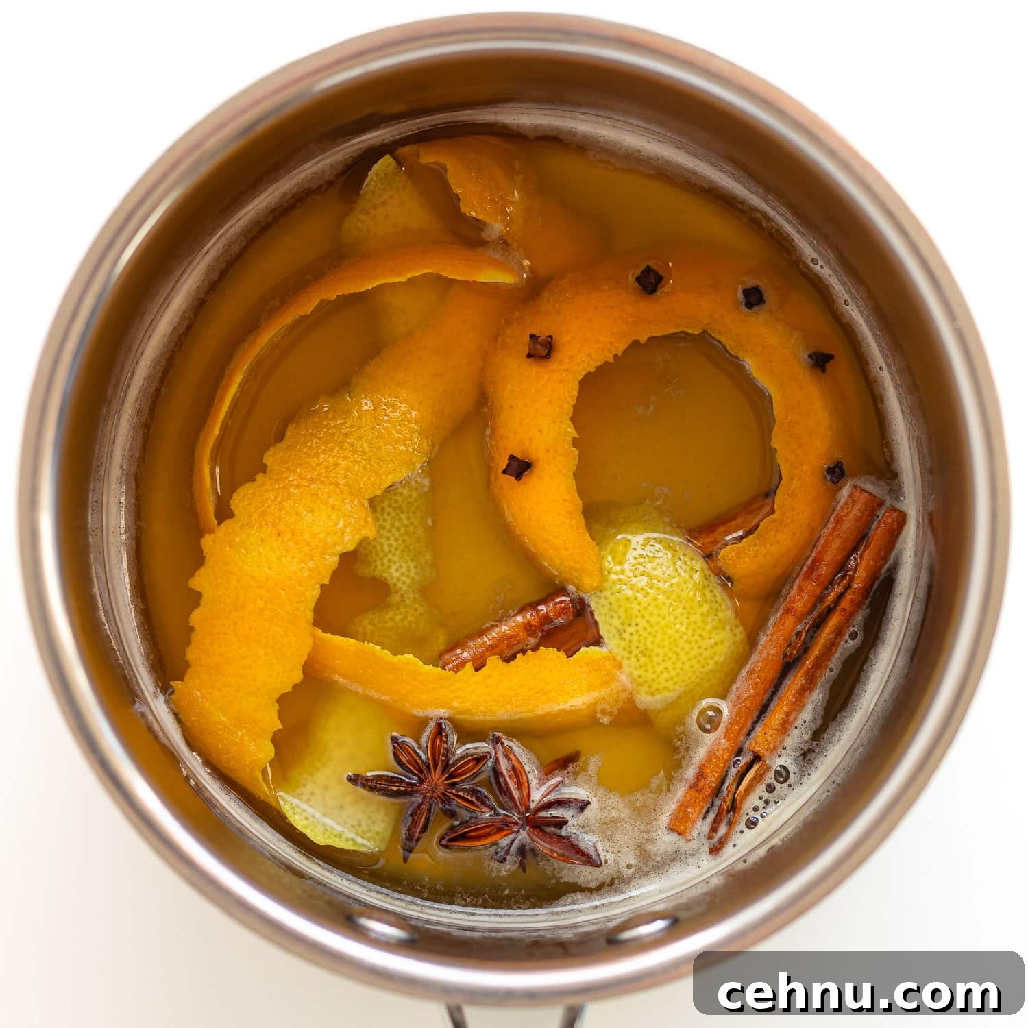 Glühwein: Traditional German Mulled Wine Recipe 6 Spiced mixture for Gluhwein in a saucepan.