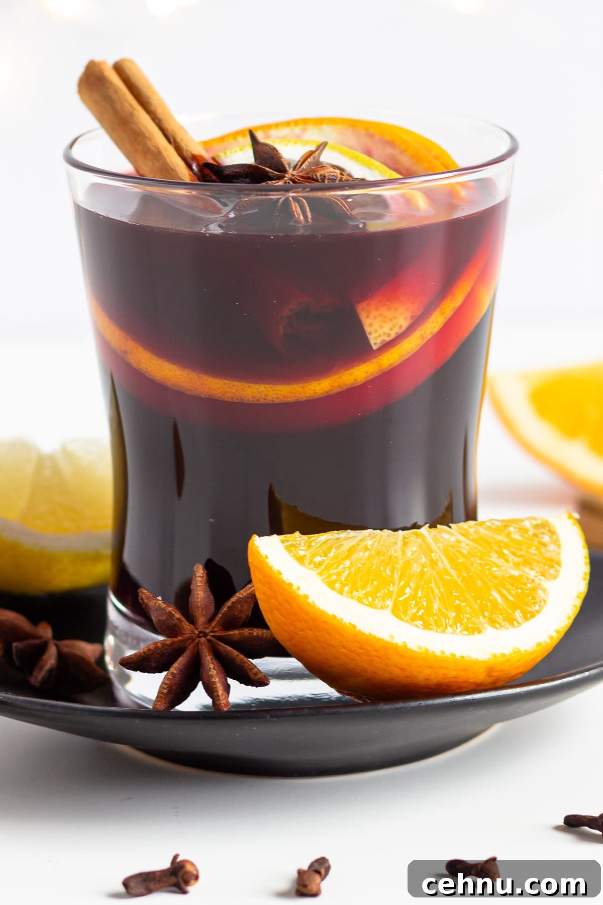 Glühwein: Traditional German Mulled Wine Recipe 9 Glass of homemade German mulled wine garnished with orange, lemon, cinnamon sticks, star anise and cloves.