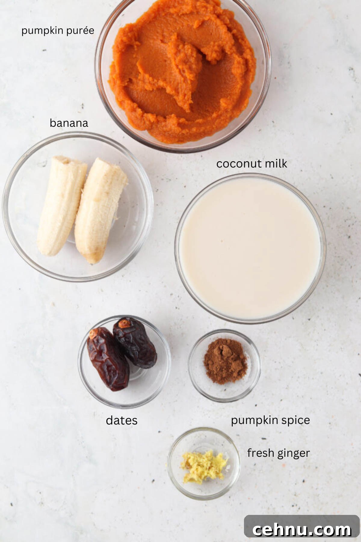 Dairy free pumpkin spice smoothie ingredients in small glass bowls.