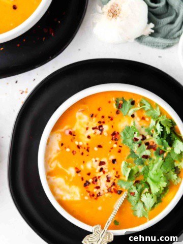 overhead shot of pumpkin soup in bowls