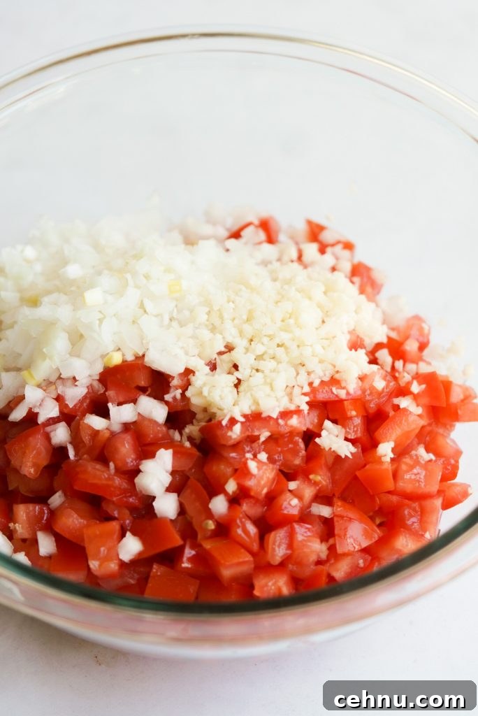 tomato, onion, and garlic in a bowl