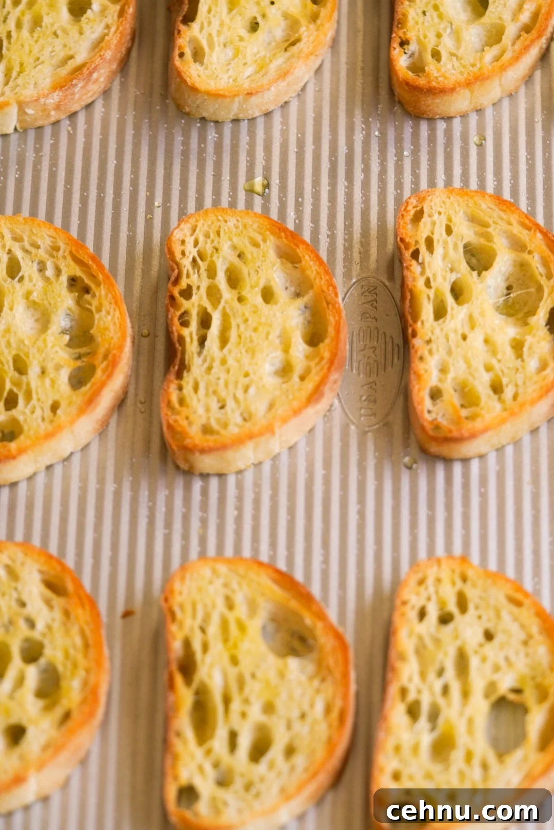 toasted ciabatta slices on a baking sheet