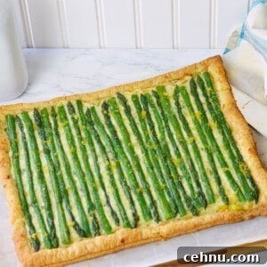 rectangle of puff pastry, cheese mixture and asparagus for featured image.