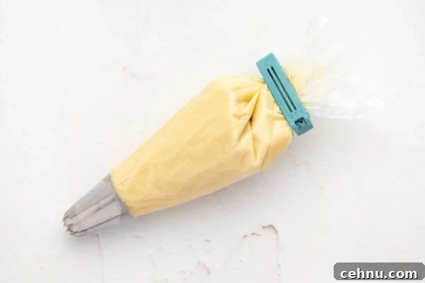 Classic Butter Cookies Recipe for Tea Time 9 Butter cookie dough in a piping bag.
