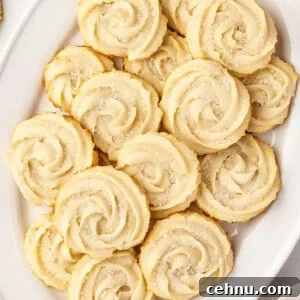 Overhead view of a butter cookies on a oval shaped serving dish.