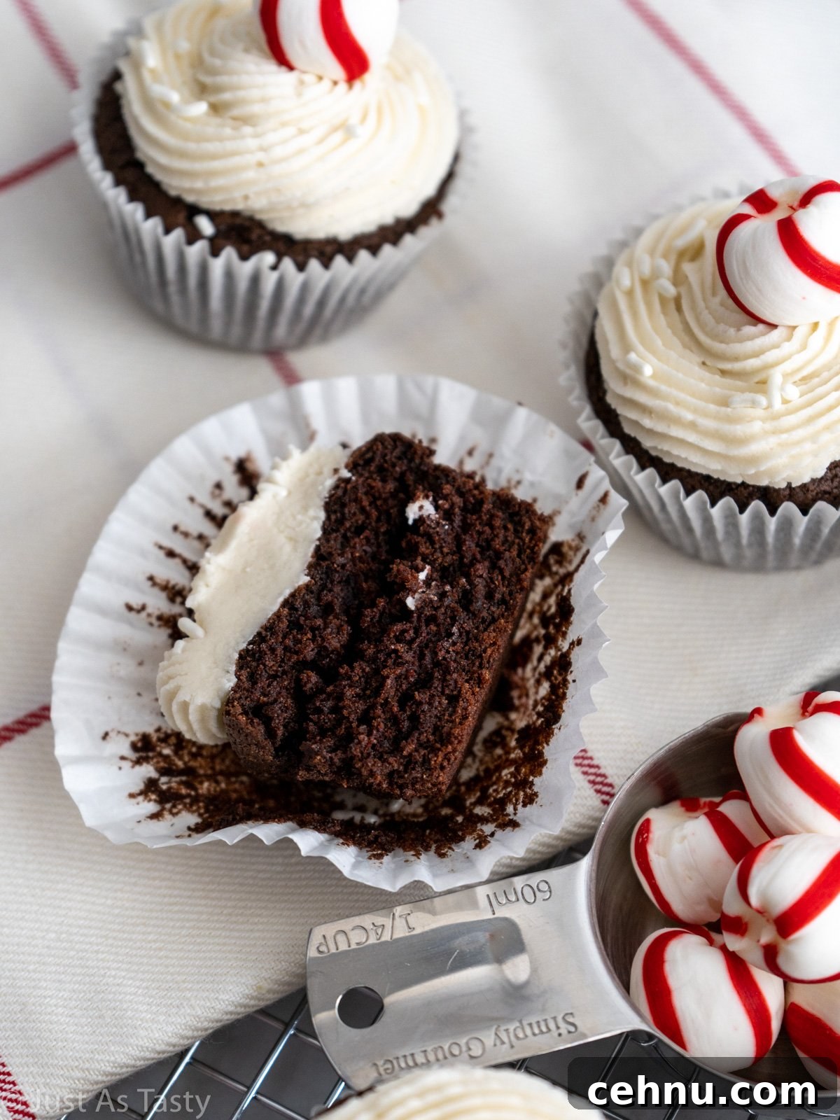 Decadent Chocolate Peppermint Cupcakes with Candy Cane Frosting 3 Close-up of a frosted chocolate cupcake cut in half.