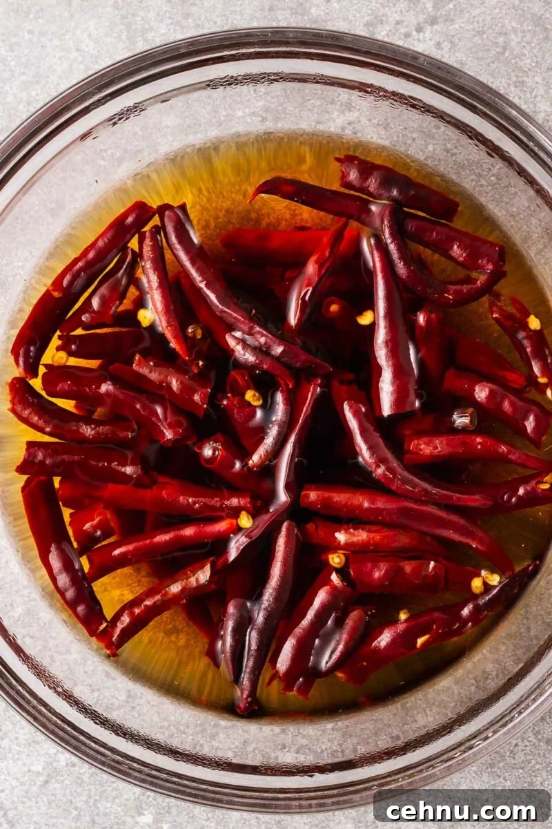 Deseeded chiles de Arbol rehydrated in boiling water.