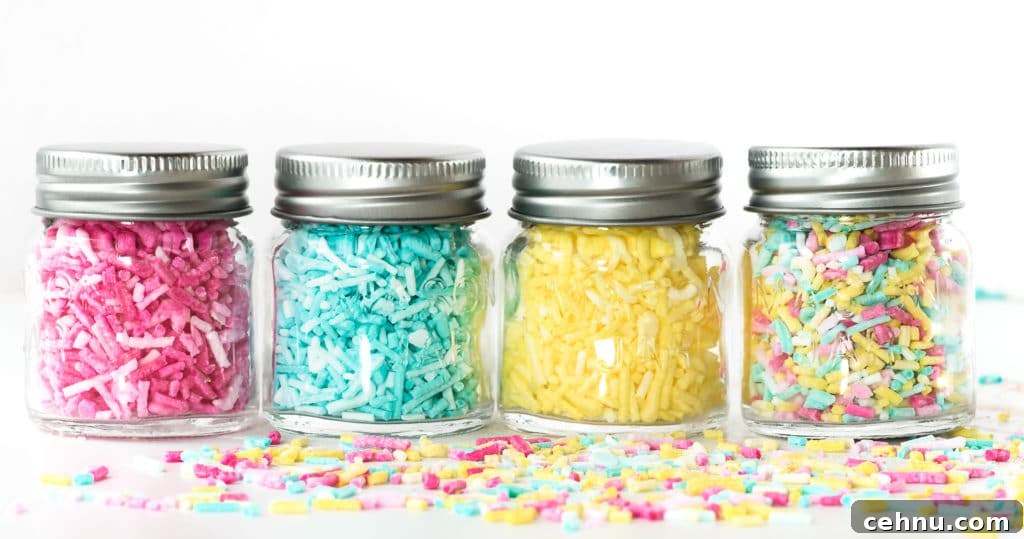 How to Make Sugar-Free Sprinkles for Low-Carb Baking 4 Four jars in a row filled with colourful ombre sprinkles