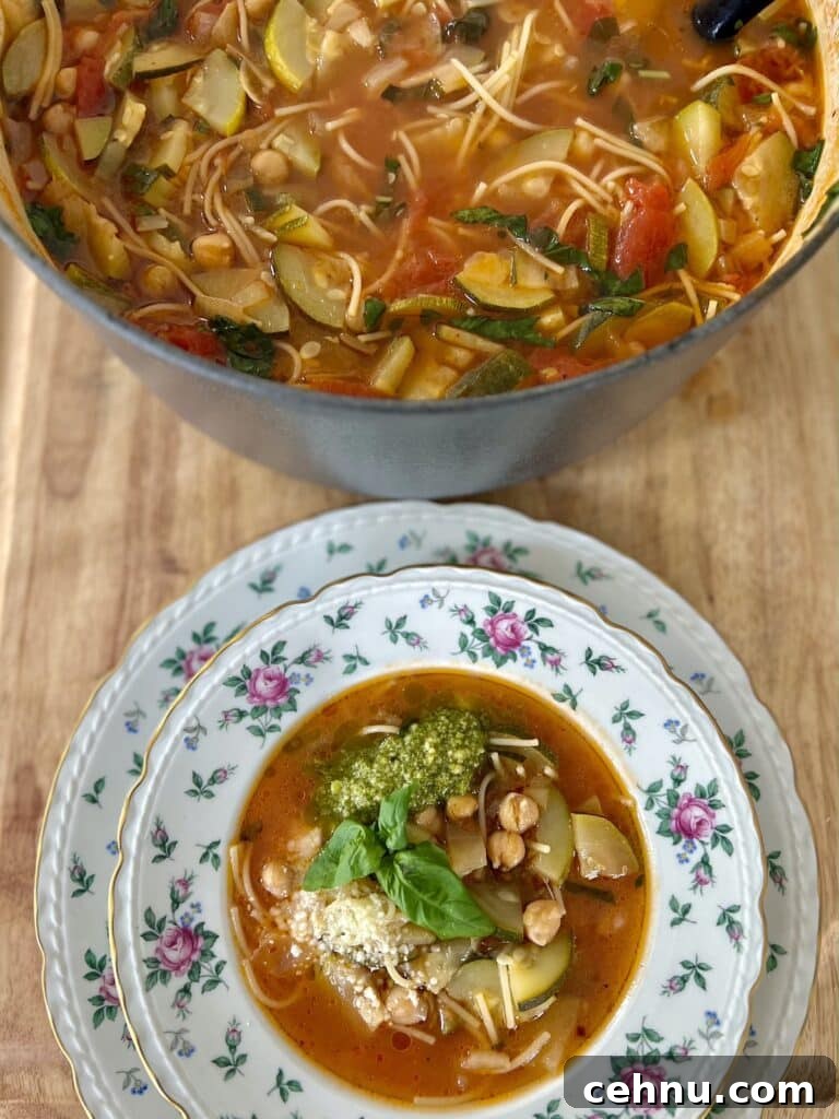 Pot of Italian zucchini soup next to bowl full of it.