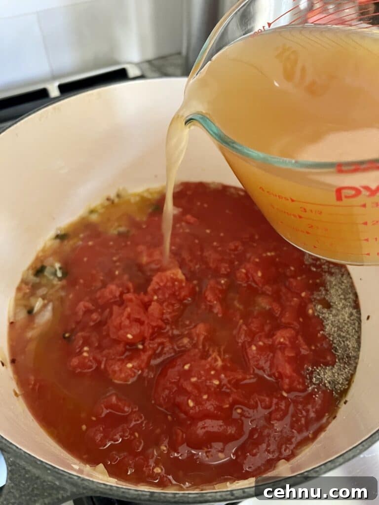Pouring broth into soup.