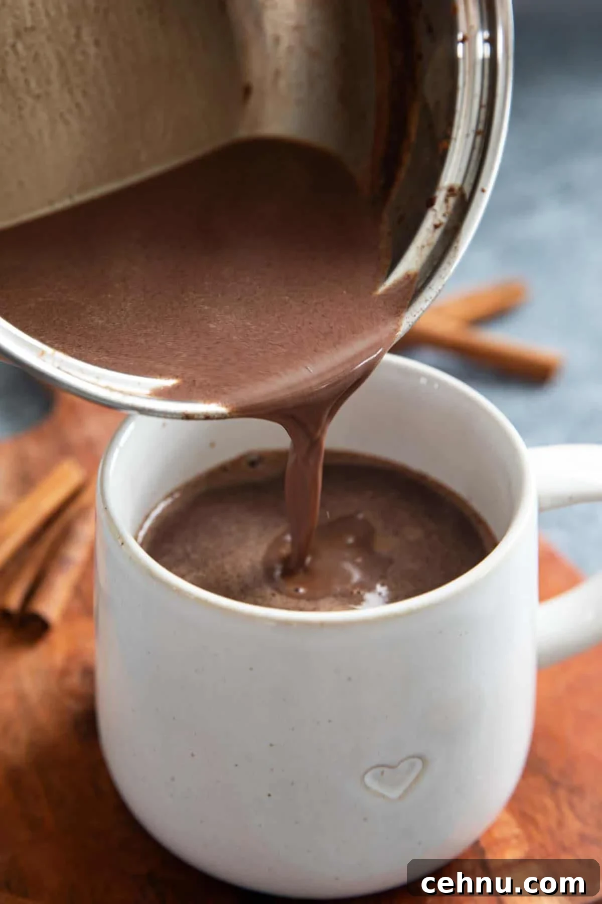 How to Make Authentic Mexican Hot Chocolate 5 Pouring Mexican Hot Chocolate into a mug.
