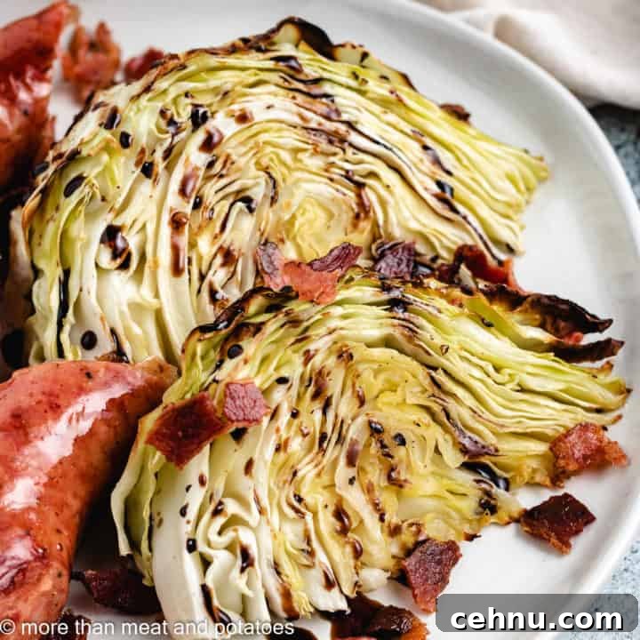 Two cabbage wedges with crumbled bacon and sausage.