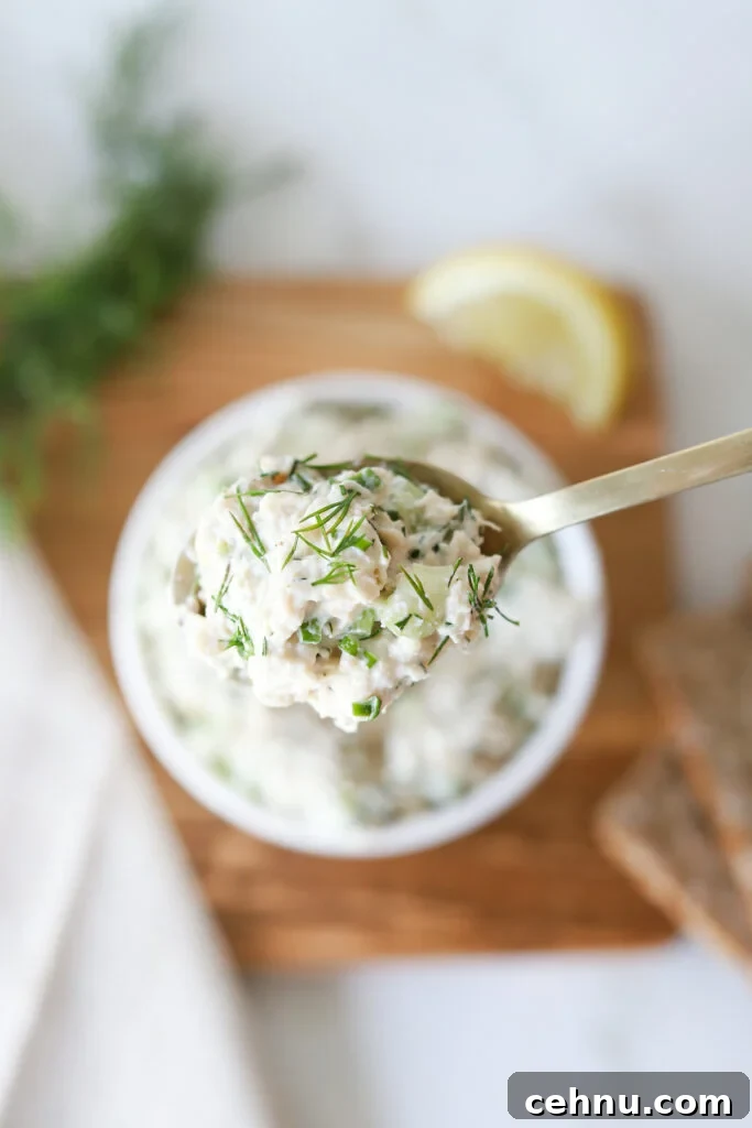 A spoonful of cottage cheese chicken salad.