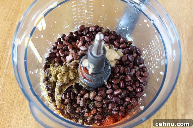 Black beans and spices in a food processor.
