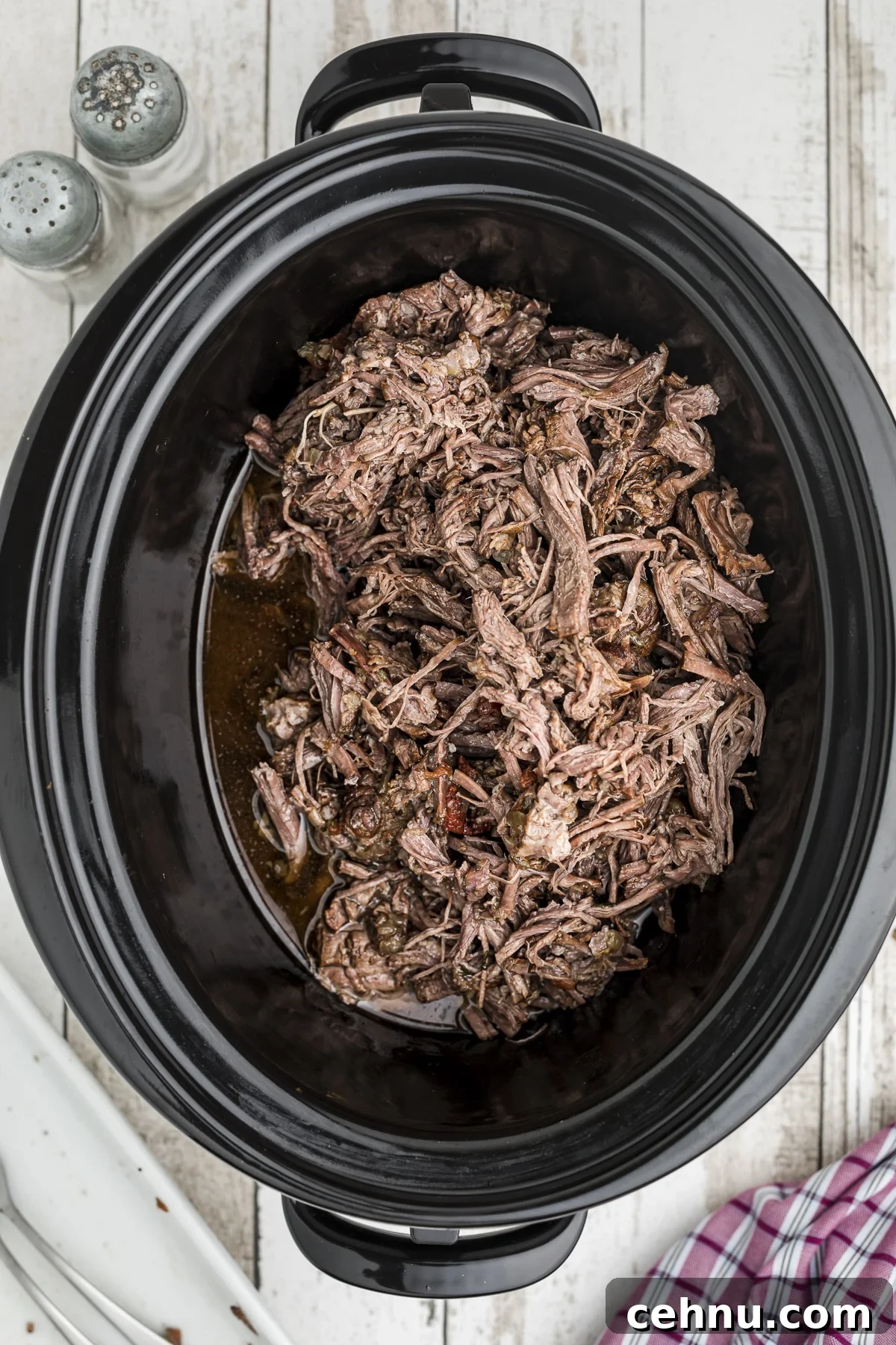 the mexican shreded beef back in the crockpot.