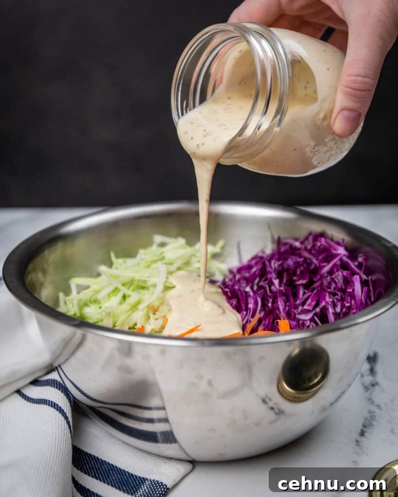 Crisp, Creamy Homemade Coleslaw Recipe 4 Coleslaw dressing being poured into a bowl