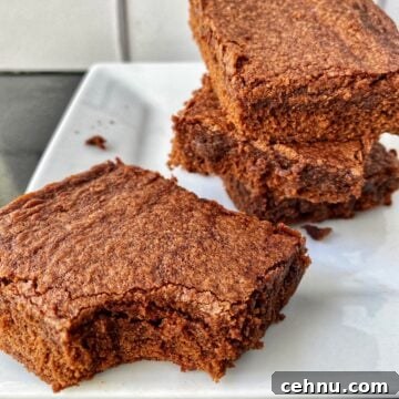 Homemade Brownie Mix Recipe for Fudgy Chocolate Brownies 10 A stack of sliced brownies, one with a bite out of it.